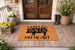 Funny pig bacon doormat featuring a cute pig silhouette and the punny phrase Don't Go Bacon My Heart, this natural coir welcome mat adds farmhouse porch decor style to your front door entrance for a humorous and welcoming home