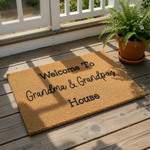 Grandma and Grandpa welcome doormat featuring natural coir fiber texture with black printed text that reads Welcome To Grandma and Grandpa's House, a durable outdoor floor mat for a front porch or entryway home decor.