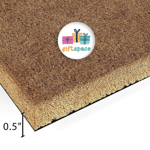 a close-up view of a brown textured surface, possibly a carpet or mat, with a circular logo featuring a gift box and the text "giftspace" on it.