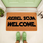 Funny sci-fi welcome doormat featuring the text Rebel Scum Welcome in bold black letters on a natural coir fiber mat, perfect for a front porch entry way or home decor for fans of space fantasy movies and galactic adventure