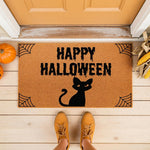 Happy Halloween black cat doormat featuring a spooky feline design and spider web corners, this natural coir welcome mat is a festive fall porch decor piece for your front door entrance during the autumn holiday season.