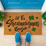 a door mat that says let the shenhangans begin
