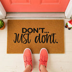 a door mat that says don't just do it