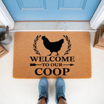 Chicken Welcome To Our Coop Doormat featuring a black hen silhouette and farmhouse style text on a natural coir fiber welcome mat, perfect for a front porch entrance or farm decor entryway floor rug for chicken lovers and