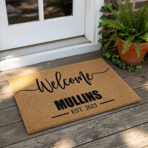 Personalized family name welcome doormat featuring a natural coir fiber texture, custom last name, and established year text for a stylish front porch entry decor piece that serves as a durable outdoor floor mat for any new home.