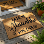 Abuelita coir doormat featuring a natural fiber texture and black printed text that reads La Mejor Abuelita Vive Aqui, making this a stylish outdoor welcome mat for a grandmother's front porch or entryway home decor.