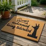 Funny Halloween doormat with a zombie hand graphic and text reading Dead welcomed living tolerated, this natural coir fiber welcome mat is a spooky porch decor piece for your front door entry, perfect for a horror fan home