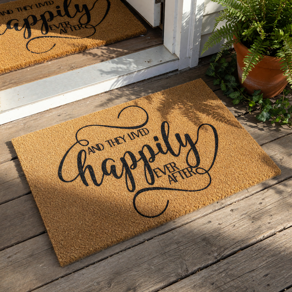 Happily Ever After coir doormat featuring elegant black script typography on a natural fiber welcome mat, perfect for a wedding or housewarming entrance decor, this durable outdoor floor rug adds a romantic touch to any home