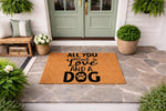Dog lover welcome doormat featuring a natural coir fiber texture and black text that reads All You Need Is Love And A Dog with a paw print, perfect for a front porch entryway decor style for pet owners and animal lovers alike.