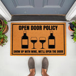 Funny wine lover doormat with Open Door Policy text and wine bottle graphics, a natural coir welcome mat for front porch decor that makes a great housewarming gift for wine drinkers who enjoy humorous home entryway floor mats.