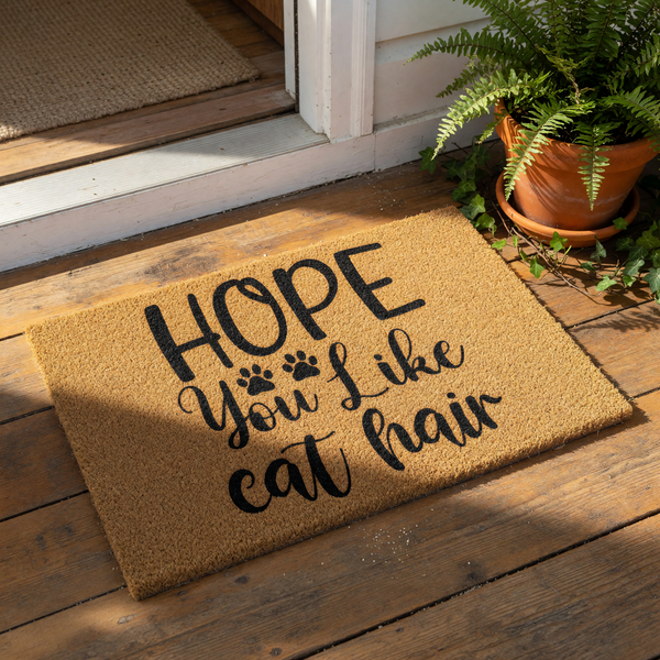 Funny cat hair doormat with black text on a natural coir fiber welcome mat, featuring a humorous quote for cat lovers and pet owners, perfect for a front porch entrance or home decor for feline enthusiasts and indoor cat
