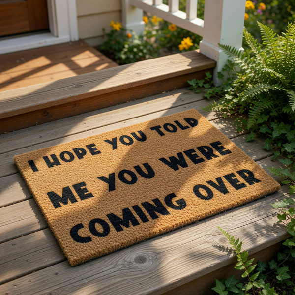 Funny doormat with the text I hope you told me you were coming over, a natural coir fiber welcome mat for front porch decor that makes a humorous housewarming gift for friends who value their privacy and home entry style.