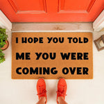 Funny welcome doormat with the text I Hope You Told Me You Were Coming Over, a natural coir fiber outdoor rug for your front porch entry that makes a humorous housewarming gift for friends and family who love sarcastic home decor.