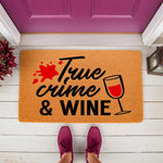 True Crime and Wine doormat featuring a red wine glass and blood splatter design on a natural coir welcome mat, perfect for a front porch entryway to show off your favorite hobby with this funny and unique home decor floor rug.