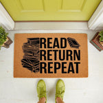 Book lover welcome doormat featuring a stack of books and the text Read Return Repeat, this natural coir fiber entry mat is a fun home decor accessory for readers, librarians, and bookish front porch entryway floor mats.