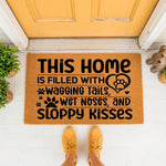 Dog lover welcome doormat featuring paw prints and text about wagging tails and sloppy kisses, placed on a porch in front of a yellow door, this natural fiber coir rug is a fun pet owner home decor piece for any dog house