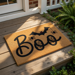Boo Halloween doormat featuring a black bat and spider design on a natural coir fiber welcome mat, perfect for fall porch decor and spooky entryway floor mats that add a festive touch to your home during the autumn holiday season.