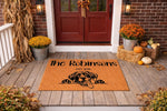 Personalized dog breed doormat featuring a cute hound illustration on a natural coir welcome mat, perfect for a fall porch decor setup with pumpkins and mums, creating a custom family name entrance rug for pet lovers and dog