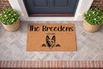 Personalized German Shepherd doormat for front porch entry, featuring a custom family name and established year on natural coir fiber.