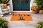 Personalized Doberman dog doormat for front porch entry, featuring a custom family name and established year on a durable coir welcome mat, creating a stylish outdoor home decor accent for any dog lover and pet owner entrance.