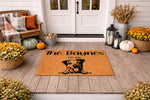 Personalized dog doormat featuring a cute terrier illustration on a natural coir welcome mat, perfect for a front porch entry.