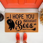 Funny Halloween doormat with a ghost and broom design, featuring the text I Hope You Brought Boos on a natural coir welcome mat for a front porch, perfect for seasonal fall home decor and spooky entryway floor mats for guests.