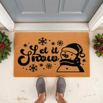 Let It Snow snowman doormat for winter porch decor, featuring a natural coir welcome mat with black holiday graphics of snowflakes and a snowman in a hat, perfect for seasonal front door entryways and festive home entrance