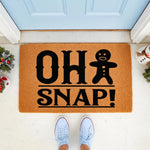 Oh Snap gingerbread man Christmas doormat for front porch decor, featuring a funny holiday cookie design on natural coir fiber.