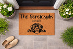 Personalized family name coir doormat featuring a cute puppy dog illustration, this custom outdoor welcome mat is a durable floor rug for your front porch entry that makes a unique housewarming decor piece for dog lovers.