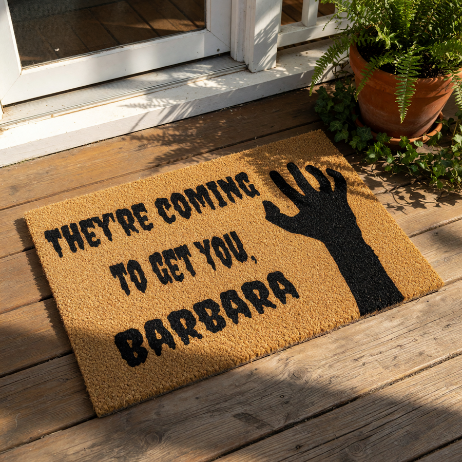 Horror movie quote doormat featuring a spooky hand silhouette and the text They are coming to get you, Barbara, this natural coir fiber welcome mat is a funny Halloween front porch decor piece for fans of classic scary cinema.