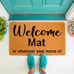 Funny Welcome Mat for front porch featuring bold black text on natural coir fiber, creating a humorous entryway decor piece that says Welcome Mat or whatever your name is, shown on a doorstep with bright teal shoes for a stylish