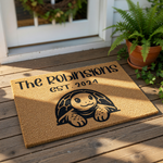 Personalized turtle family doormat featuring a cute tortoise illustration, custom last name text, and established year on a natural coir welcome mat, perfect for a housewarming gift or front porch decor for animal lovers.