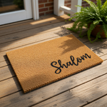 Shalom coir doormat with a natural fiber texture and black script lettering, this durable outdoor welcome mat is a stylish entryway rug for your front porch or home entrance, providing a warm greeting for all your guests and