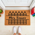 Personalized teacher doormat with pencil design on natural coir fiber, featuring a custom name for a classroom entrance or front porch welcome mat, perfect for school staff appreciation and back to school decor for a teacher home