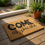 Come As You Are coir doormat with bold black typography on a natural fiber welcome mat, perfect for a front porch entry, housewarming gift, or modern home decor floor rug that adds a welcoming touch to any entryway or apartment