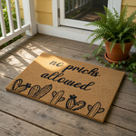 Funny cactus doormat with the text no pricks allowed, featuring a natural coir fiber texture and black ink design of various desert plants, this humorous welcome mat is a perfect front porch decor piece for any home entrance.