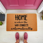 Funny doormat with text Home is where the wifi connects automatically, a natural fiber coir welcome mat for front porch decor.