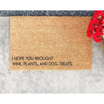 Funny coir doormat with the text I hope you brought wine, plants, and dog treats, featuring a natural fiber welcome mat design for a front porch entrance that makes a humorous housewarming gift for wine and dog lovers.