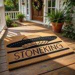 Personalized UFO doormat featuring a black flying saucer graphic on a natural coir welcome mat, perfect for sci-fi fans looking for a custom outdoor entrance rug or a unique housewarming gift for a space-themed home entryway.