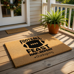 Football Feast Nap Repeat Thanksgiving doormat featuring a natural coir fiber welcome mat on a front porch, perfect for fall home decor and holiday entryway styling with its bold black text and sports-themed design for autumn.