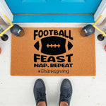Football Thanksgiving doormat with a funny holiday quote, featuring a natural coir welcome mat on a porch with sports decor, perfect for fall home entryways and seasonal front door decor for sports fans who love autumn