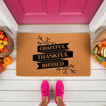 Grateful Thankful Blessed fall doormat featuring a natural coir welcome mat design with black text on a porch, perfect for autumn home decor, seasonal entryway rugs, and rustic farmhouse front door decorations for the holiday