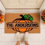Personalized pumpkin doormat for fall porch decor, featuring a custom family name on a natural coir welcome mat with a festive orange pumpkin design, perfect for autumn home entryways and seasonal housewarming front door styling.
