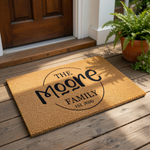 Personalized family name coir doormat featuring a circular design with custom text, this durable natural fiber welcome mat is a stylish housewarming decor piece for your front porch entry and home entrance floor.