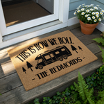 Personalized camping doormat featuring a motorhome graphic and pine trees with the text This Is How We Roll, a custom outdoor welcome mat for RV owners, campers, and travel enthusiasts looking for a durable, natural fiber floor