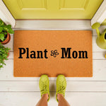 Plant Mom coir doormat featuring a cute flower icon, perfect for a front porch entrance.