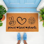 Peace Love Plants doormat featuring a fun botanical design on natural coir fiber, perfect for a front porch entry.