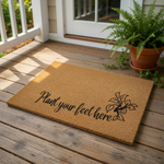 Plant your feet here coir doormat with a black leaf design, featuring a natural fiber welcome mat for your front porch or entryway that adds a stylish touch to your home decor and outdoor floor entrance area.