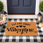 I'm My Own Valentine doormat for front porch decor, featuring a natural coir fiber welcome mat with black script text and hearts, layered over a black and white buffalo plaid rug for a stylish seasonal entryway look.