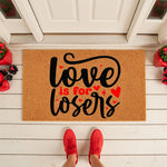 Funny Love Is For Losers doormat featuring bold black script text and red hearts on a natural coir fiber welcome mat, perfect for a sarcastic front porch entry decor piece that adds humor to your home entrance and entryway floor.